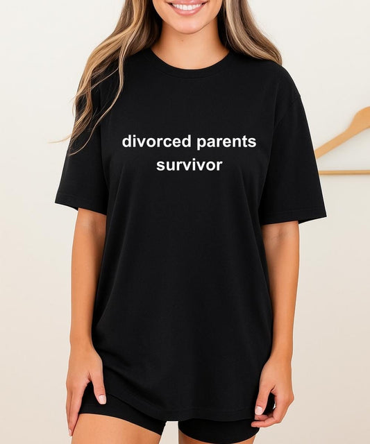 Black t-shirt with white minimalist text reading “divorced parents survivor”.