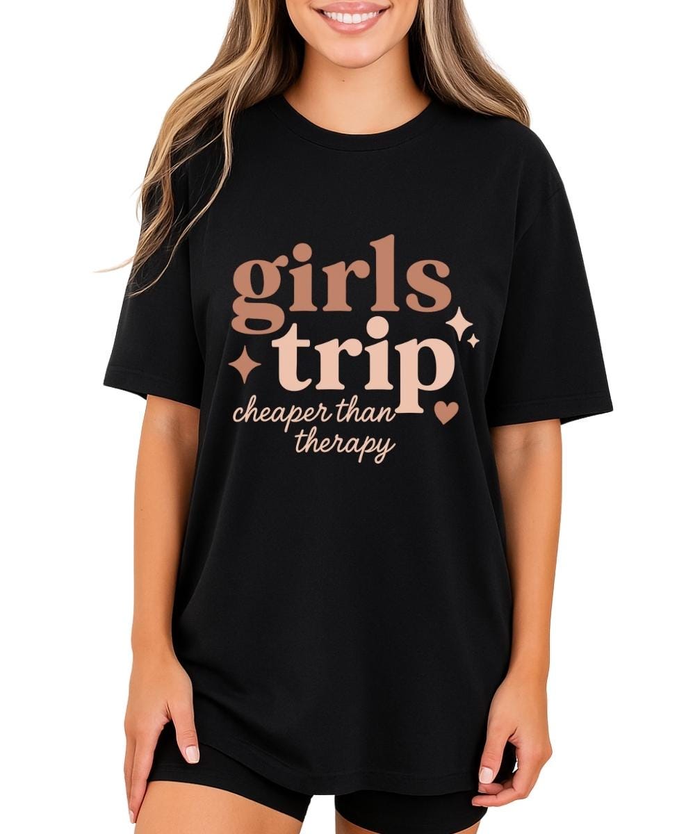 Black girls trip t-shirt with retro text reading “girls trip cheaper than therapy” and sparkle accents