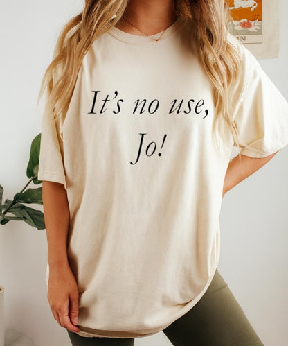 Cream t-shirt with “It’s no use, Jo!” quote in black script lettering